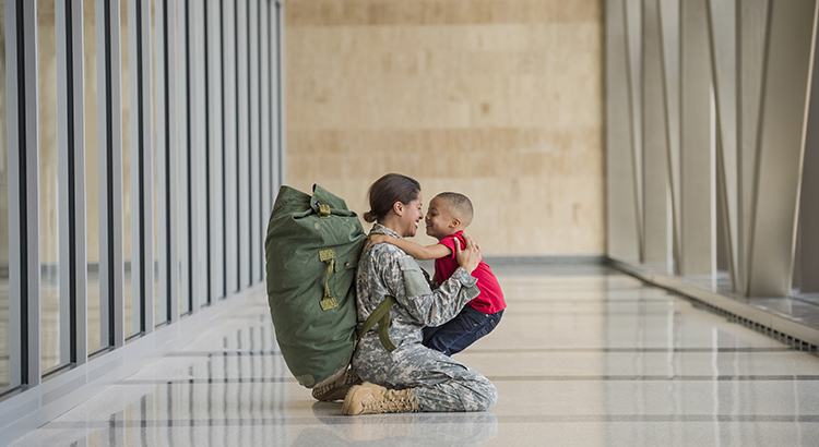 American soldier hugging son in airport